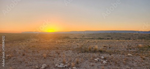 A scenic sunset view of desolate desert landscape in New Mexico. 