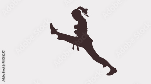 Silhouette of a woman doing a martial art kick. 