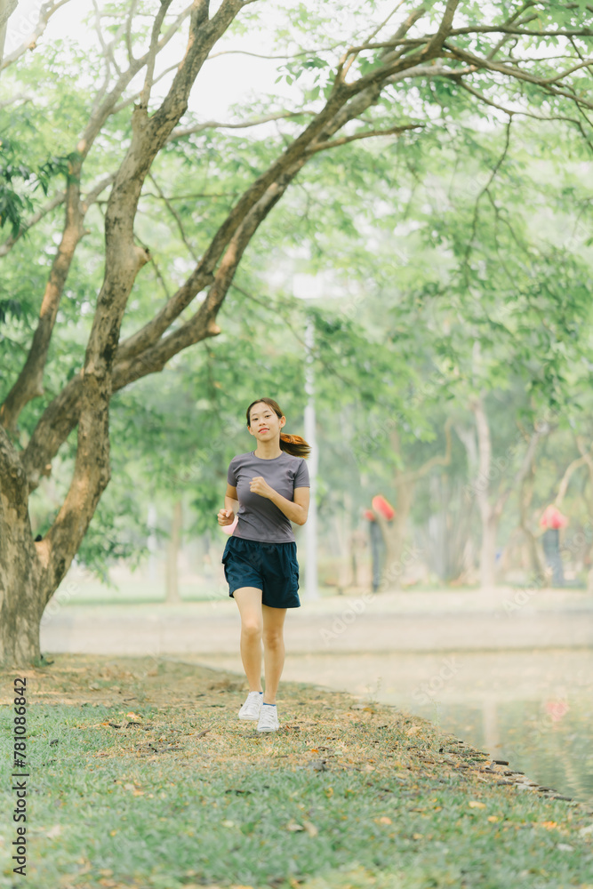 Beautiful Sport woman in sportswear running in the park. Healthy lifestyle and sport concept. Beautiful Sport woman in sportswear running in the park. Healthy lifestyle and sport concept.