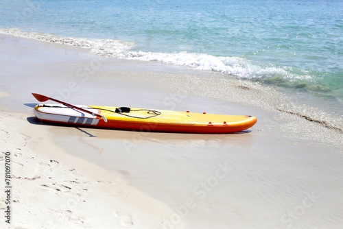 Yellow supboard on the beach
