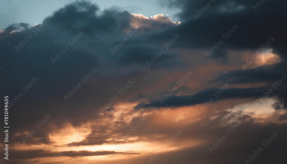 sun rays on sunset sky with blue ond orange colorful sunset clouds
