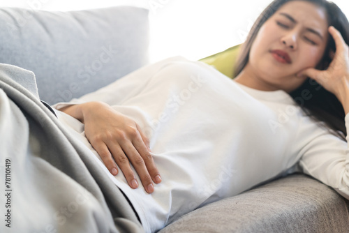 woman have a stomach pain from menstruation at home.