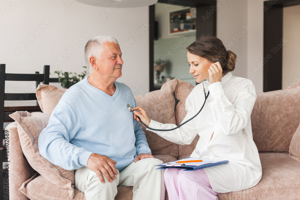 Obraz premium Woman nurse doctor gp holding stethoscope examining old senior 60s grandpa patient check heartbeat at home care checkup medical visit