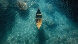 Artistic overhead view of a lone canoe on water