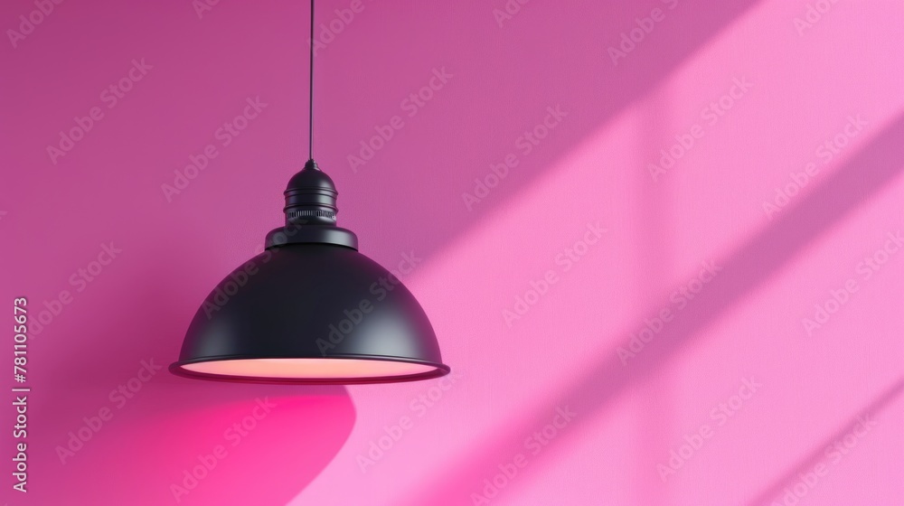 Obraz premium Modern Black Pendant Light on Vibrant Pink Background with Shadows