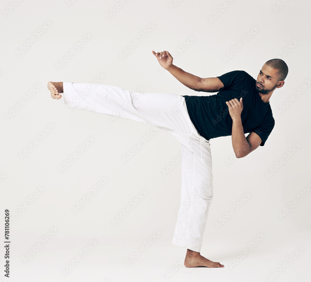 Martial arts, karate and man with training, fitness and wellness on a white studio background. Healthy person, fighter and model with practice and self defense with sports and striking with workout Martial arts, karate and man with training, fitness and wellness on a white studio background. Healthy person, fighter and model with practice and self defense with sports and striking with workout