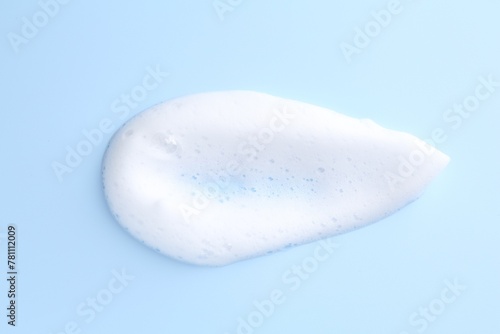 Sample of fluffy foam on light blue background, top view © New Africa