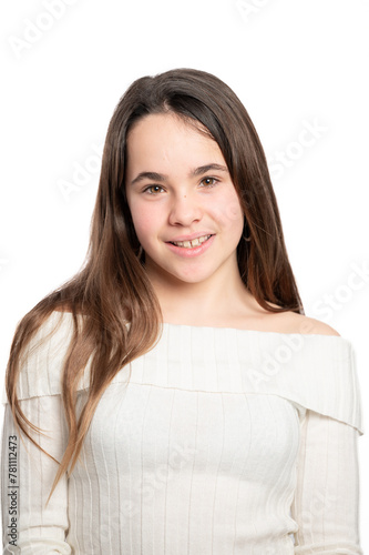 A girl with long brown hair is smiling for the camera