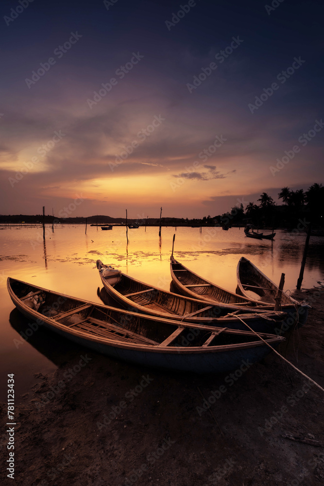 Traditional boats at O Loan lagoon in sunset, Phu Yen province, Vietnam