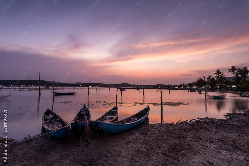 Traditional boats at O Loan lagoon in sunset, Phu Yen province, Vietnam