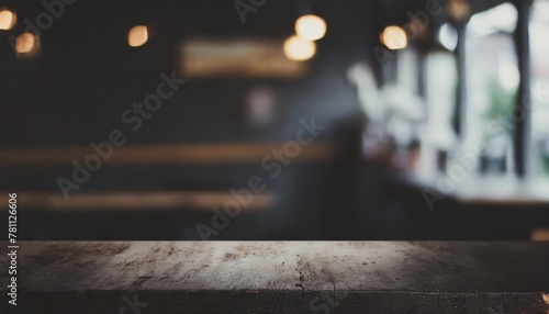 empty wooden table in front of abstract blurred background of coffee shop can be used for display or montage your products mock up for display of product photo
