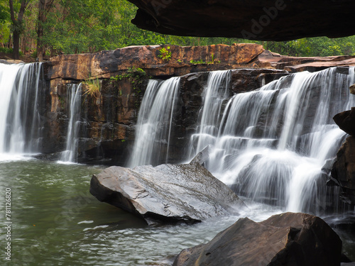 Cool waterfall flowing in the deep forest  shady atmosphere.