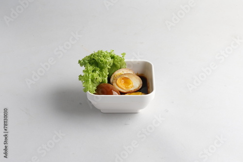 dark soy sauce japanese lava braised chicken egg yolk chinese herbal tea in bowl on white table asian restaurant banquet cafe cuisine halal food menu