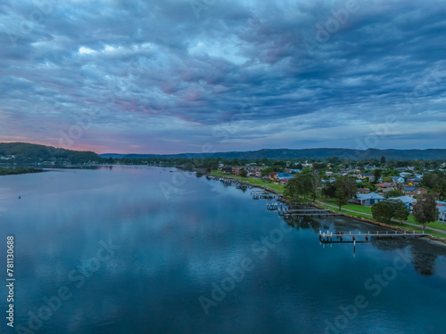 Sunrise over the bay water with clouds and reflections