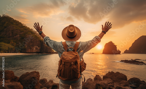 Youthful fellow with backpack and hat admiring ocean vista