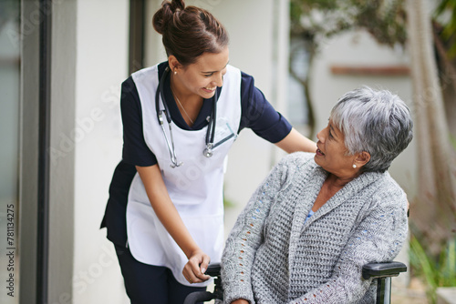 Senior woman and wheelchair at nursing home with carer for assistance in closeup, help at clinic. Disabled retiree and medical or outdoors for talk or plan for healthcare, conversation with nurse