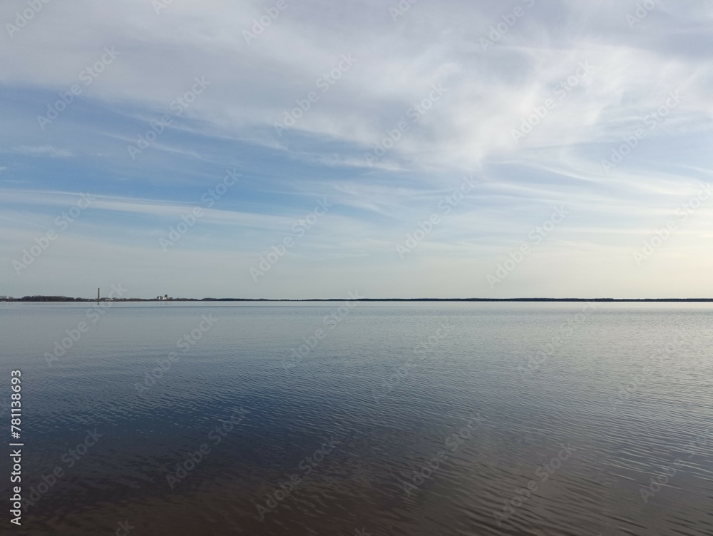 Rekyva lake during cloudy day. Cloudy day. Wavy lake. White and gray colored clouds. Horizon over water. Rekyvos ezeras. Rekyva lake during cloudy day. Cloudy day. Wavy lake. White and gray colored clouds. Horizon over water. Rekyvos ezeras.