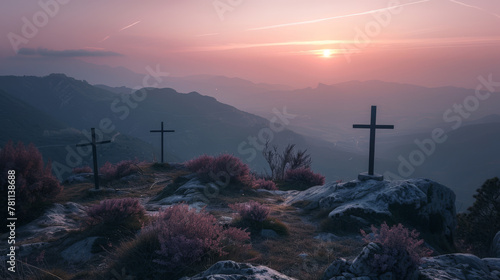 Three crosses on the top of a mountain at a beautiful sunrise.