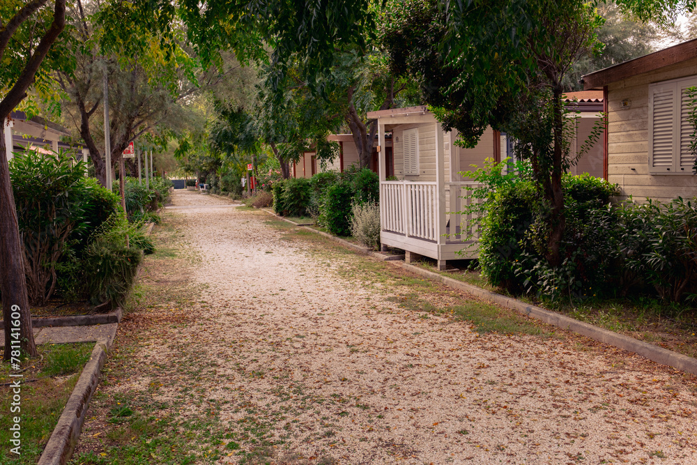 Camping by the sea. Mini houses stand in a line among the greenery. Camping by the sea. Mini houses stand in a line among the greenery.