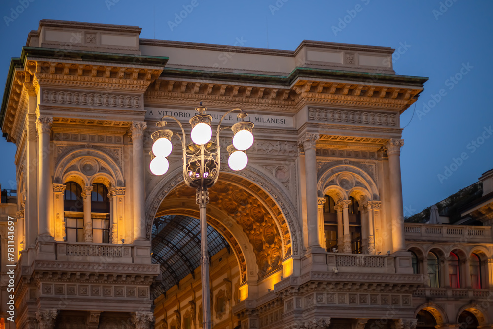 Obraz premium Galleria Vittorio Emmanuel Passage, main entrance to a luxury shopping center evening time. Italy, Milan
