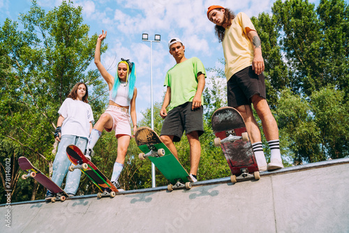 Group of professional skaters teens at the skatepark