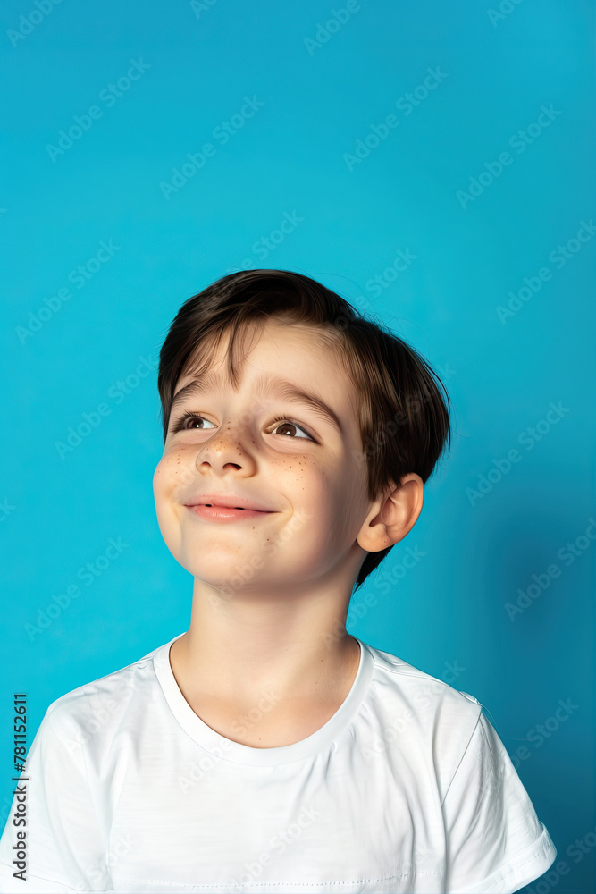 Portrait of a smiling boy on a blue background
Portrait of a smiling boy on a blue background