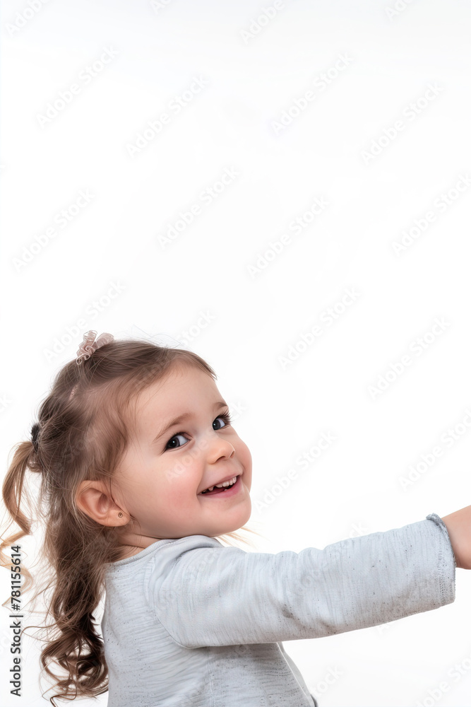 A little girl on a white background points her finger to the side
A little girl on a white background points her finger to the side