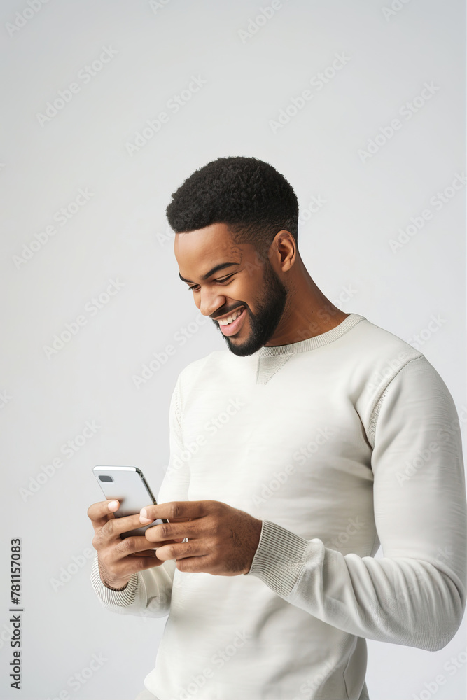 A man on a white background looks into a smartphone
