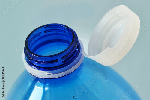 Close-up of cap attached to the neck of the plastic water bottle © calypso77