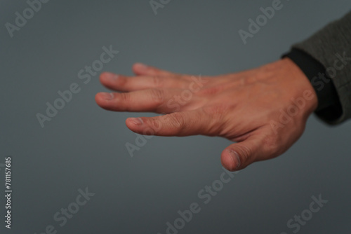 businessman in suit showing five fingers or fingerprint scan touching