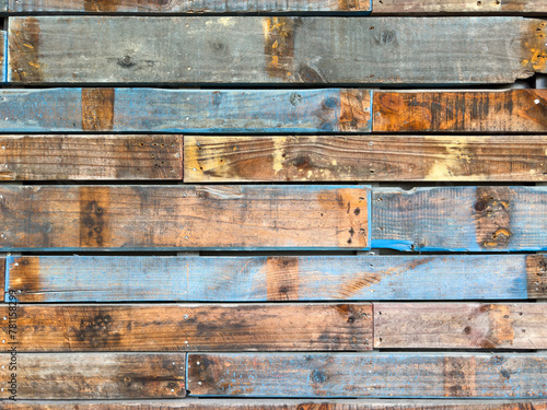 Rough wood texture. Brown and blue planks from old pallets.
