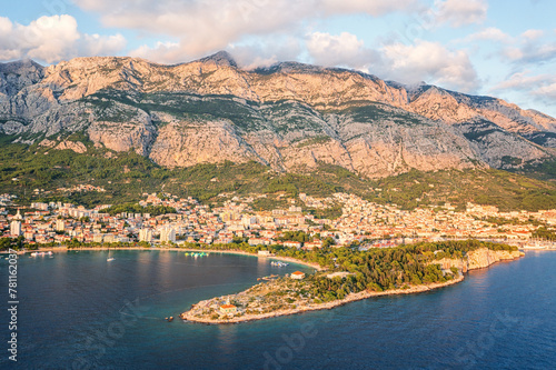 Beautiful aerial view of the town of Makarska, Dalmatia, Croatia. Summer landscape with yachts, sea, architecture and rocks, famous tourist destination at Adriatic seacoast, travel background