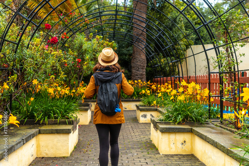 A woman walking through a beautiful botanical garden, a sustainable tourism concept in Arucas, Gran Canaria. Spain photo