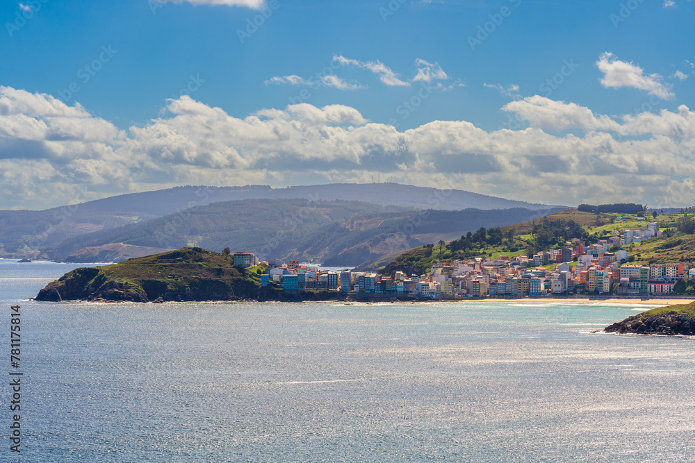 Fototapeta premium Serene Coastal Town by the Bay Under a Clear Blue Sky on a Sunny Day, Costa da Morte, Malpica, Galicia, Spain
