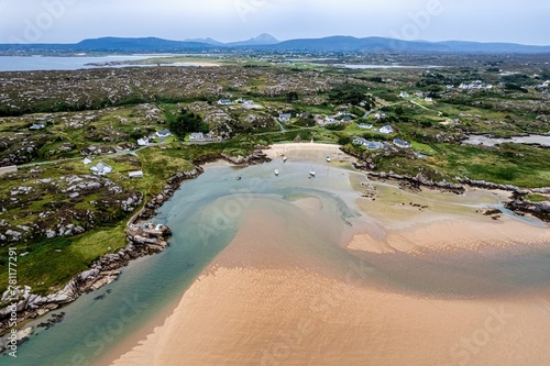 Aerial shot of the Atlantic ocean meeting the sandy shores of the County Donegal in Ireland on