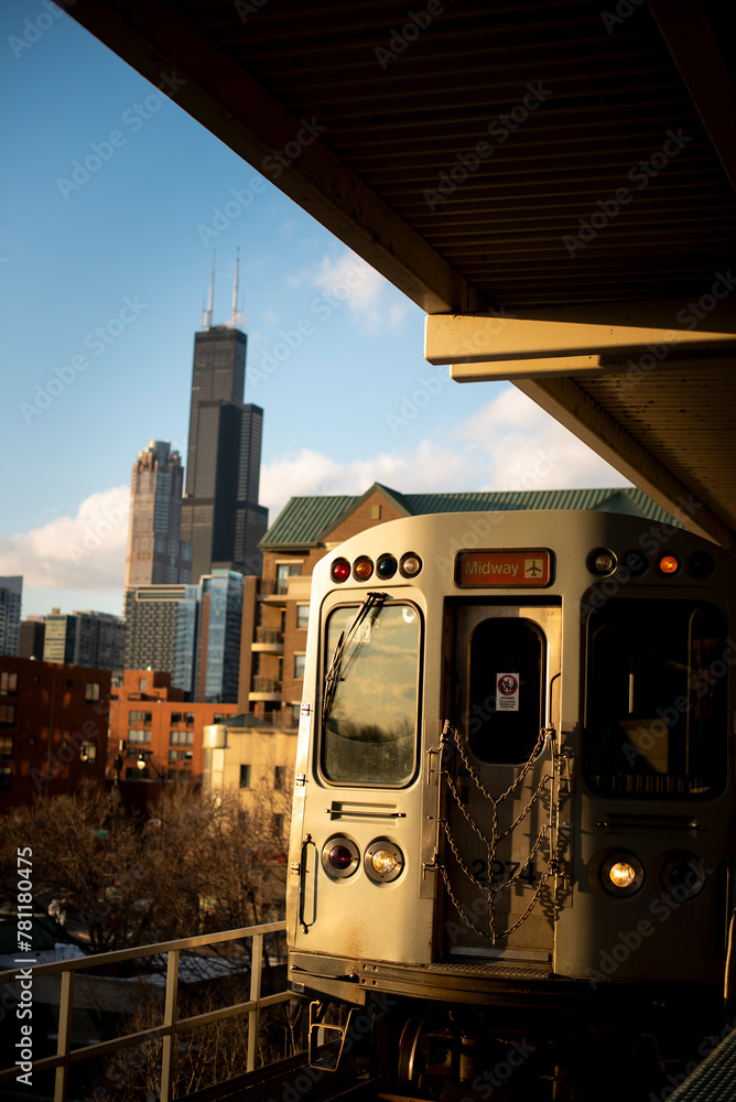 Backside of the train on the railroad against the modern buildings in Chicago