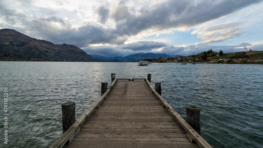 Closeup of a wooden path bridge over the lake in New Zealand