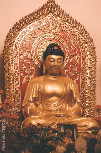 Closeup of a golden Buddha statue in a temple