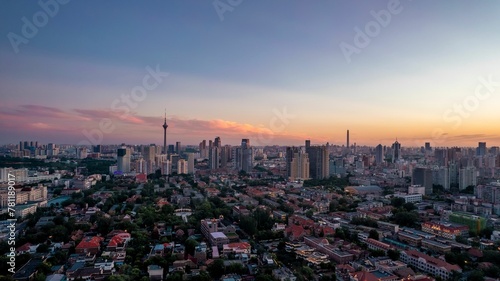 Aerial view of cityscape Tianjin surrounded by buildings during sunset