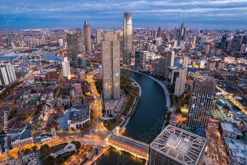 Aerial view of the Haihe River and the modern skyscrapers under the cloudy sky in Tianjin China