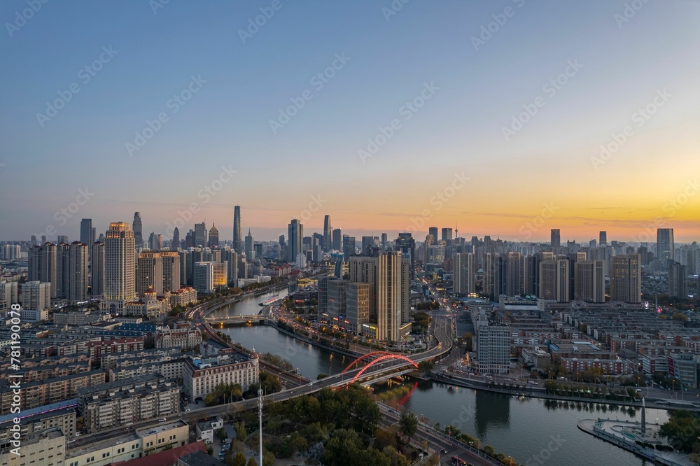 High-angle view of city full of skyscrapers under the blue sky.