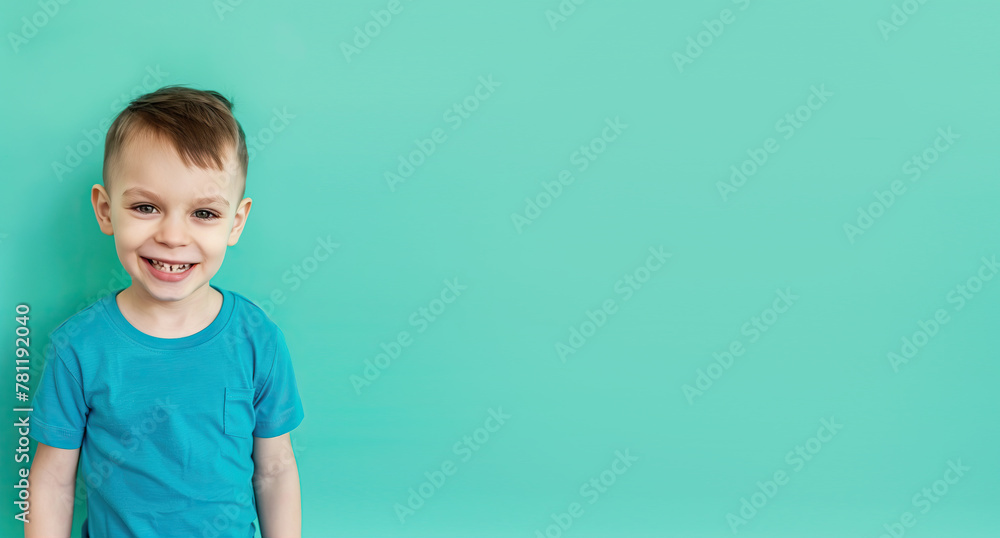 Cute little boy on mint background
