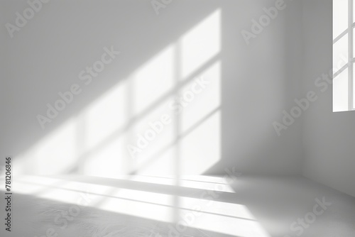 A room with a large window that is letting in a lot of sunlight. The room is empty and has a very clean and bright appearance