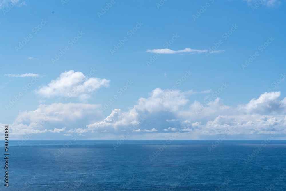 View of blue sea and clouds in a blue sky