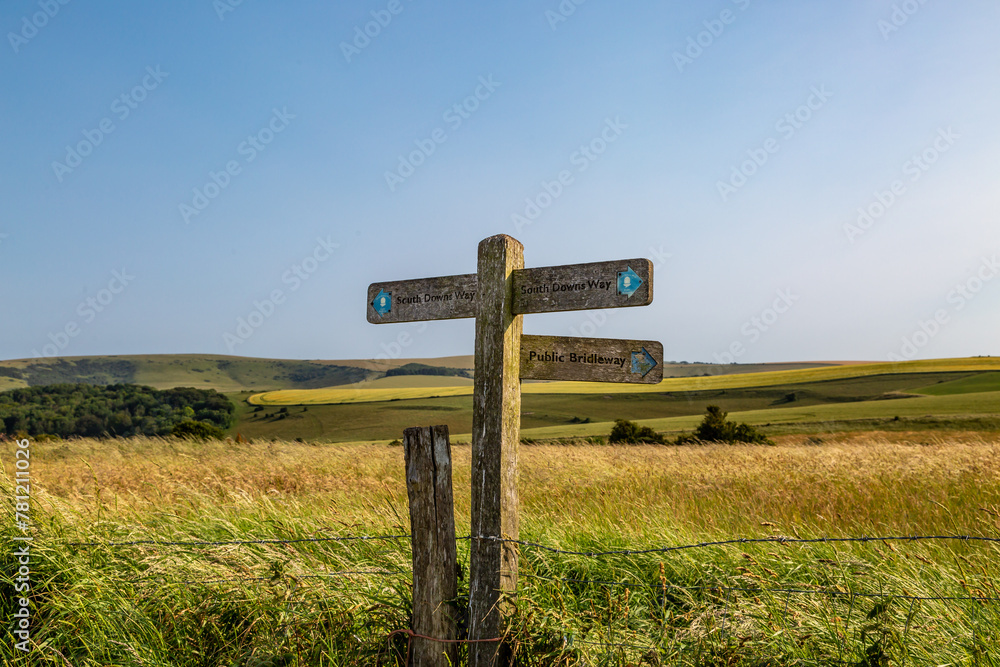 A directional sign post in the South Downs on a sunny summer's day A directional sign post in the South Downs on a sunny summer's day