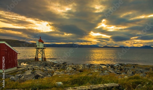 Fuglenes lighthouse in Norway, on the background of the sunrise