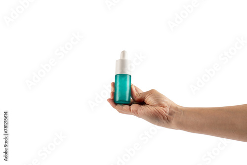 Blue glass cosmetic bottle in hand, Skin care or sunscreen cosmetic on transparent background.