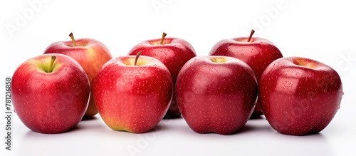 Many apples clustered on table photo