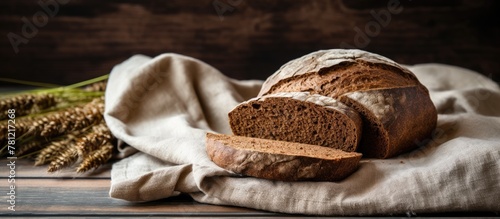 Loaf of bread on fabric nea...