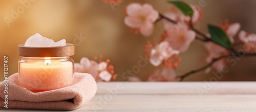 Candle on table with towel